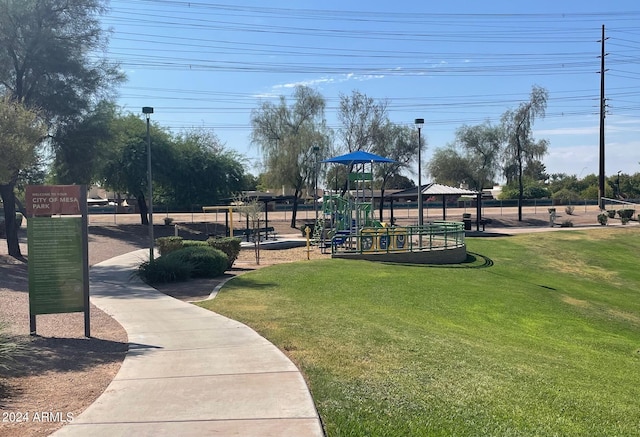 view of home's community with a playground, a gazebo, and a yard