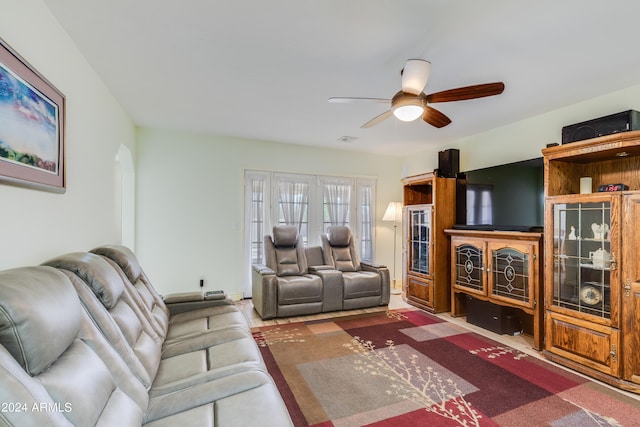 living room with ceiling fan and french doors