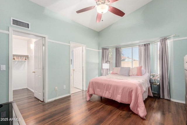 2615 N 123rd Dr, Avondale, AZ 85392 - bedroom featuring wood finished floors, baseboards, a ceiling fan, high vaulted ceiling, and a walk in closet