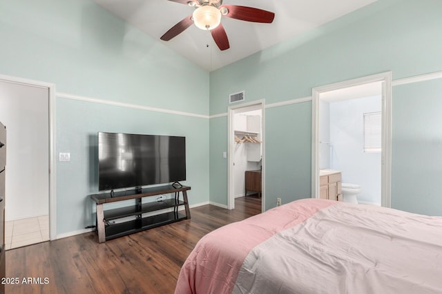 2615 N 123rd Dr, Avondale, AZ 85392 - bedroom featuring wood finished floors, a walk in closet, high vaulted ceiling, ensuite bathroom, and ceiling fan
