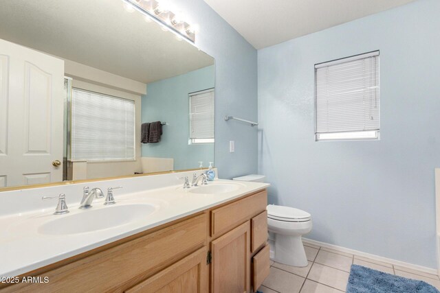 2615 N 123rd Dr, Avondale, AZ 85392 - bathroom with toilet, tile patterned flooring, double vanity, and baseboards