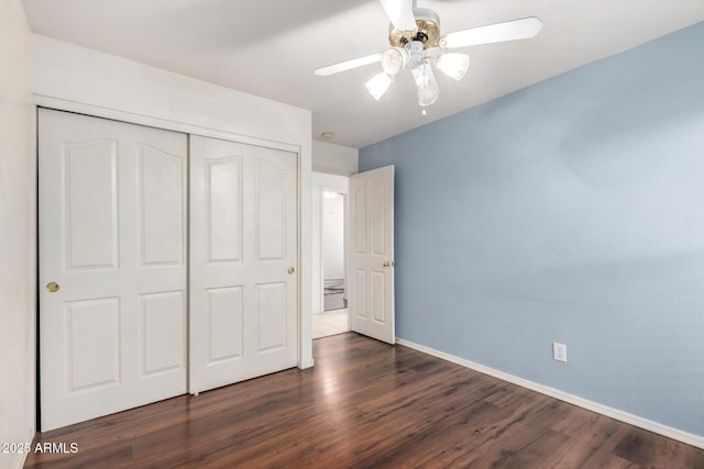 2615 N 123rd Dr, Avondale, AZ 85392 - unfurnished bedroom featuring a closet, dark wood-style flooring, baseboards, and ceiling fan