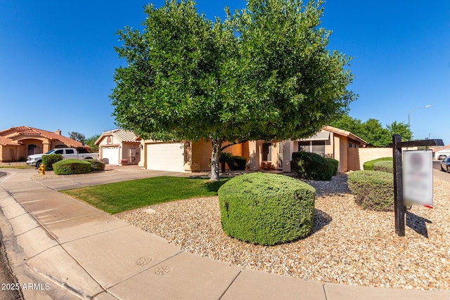 2615 N 123rd Dr, Avondale, AZ 85392 - view of front of property with driveway, an attached garage, and stucco siding