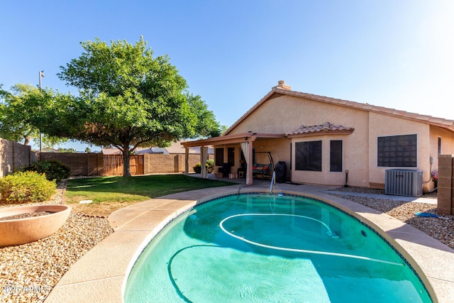 2615 N 123rd Dr, Avondale, AZ 85392 - view of swimming pool featuring central air condition unit and a patio area