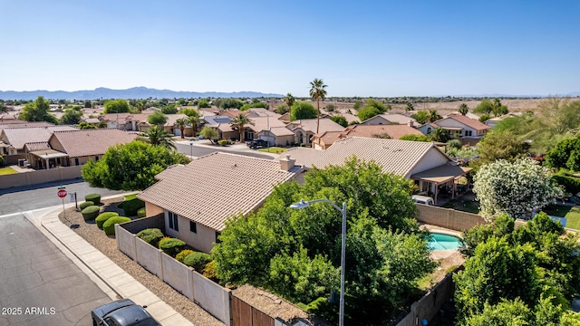 2615 N 123rd Dr, Avondale, AZ 85392 - aerial view of residential area with a pool area and a mountainous background