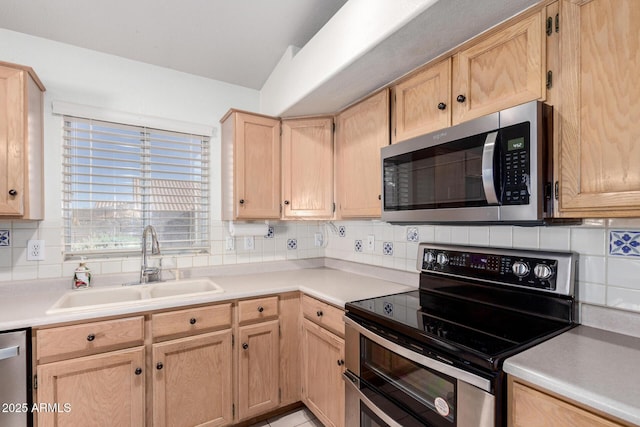2615 N 123rd Dr, Avondale, AZ 85392 - kitchen with appliances with stainless steel finishes, a sink, light brown cabinetry, decorative backsplash, and light countertops