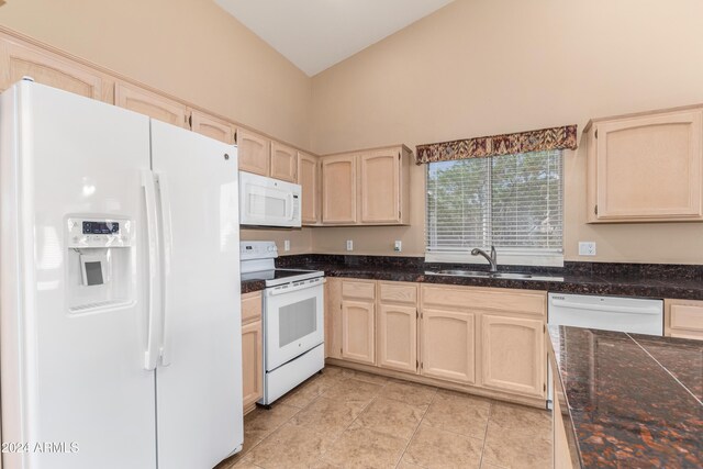 14766 W Piccadilly Rd, Goodyear, AZ 85395 - kitchen featuring white appliances, high vaulted ceiling, a sink, and light brown cabinets