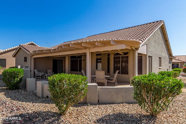 back of house with a patio area