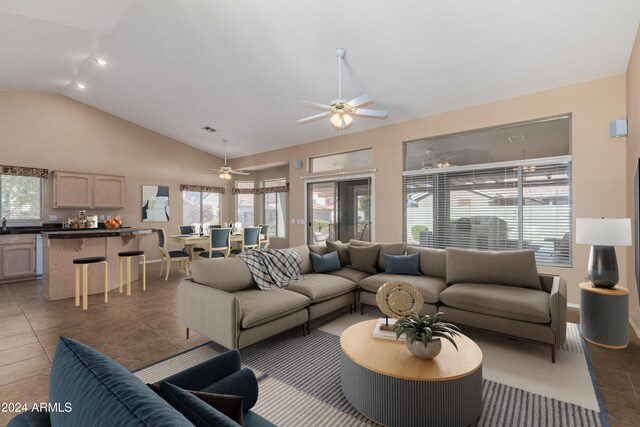 14766 W Piccadilly Rd, Goodyear, AZ 85395 - tiled living area featuring baseboards, a ceiling fan, vaulted ceiling, and visible vents