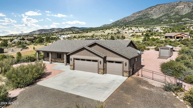 view of front of house with a mountain view and a garage