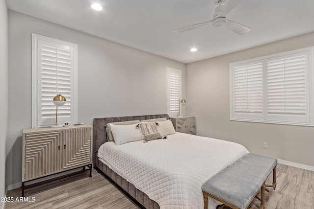 bedroom featuring ceiling fan and light hardwood / wood-style flooring