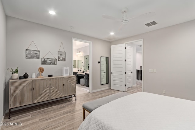 bedroom with ensuite bathroom, ceiling fan, and light wood-type flooring