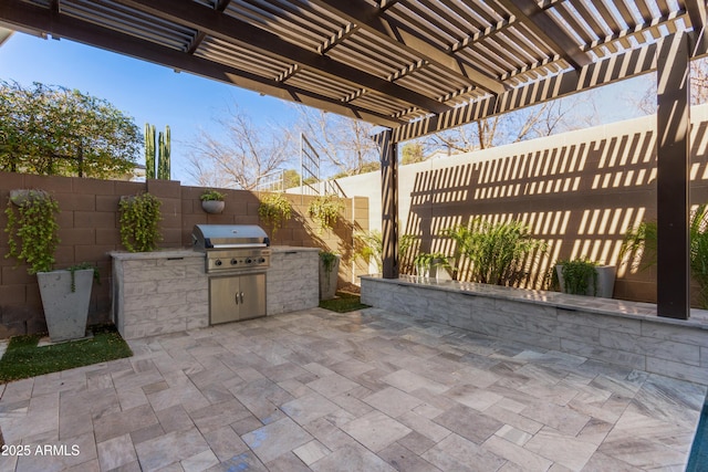 view of patio featuring area for grilling and a pergola