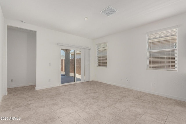 spare room with light tile patterned floors