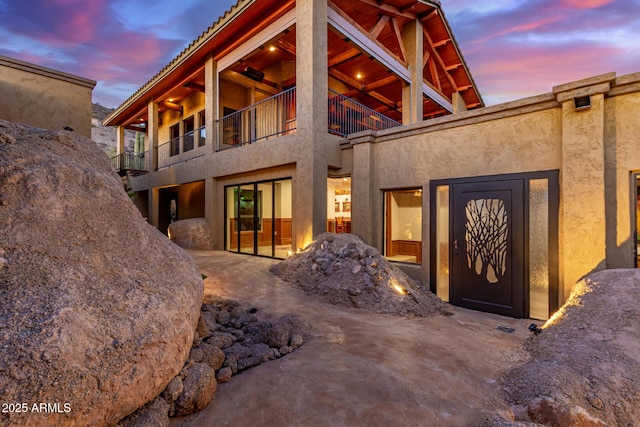 8752 E Range Rider Trl, Mesa, AZ 85207 - back of house with a balcony and stucco siding