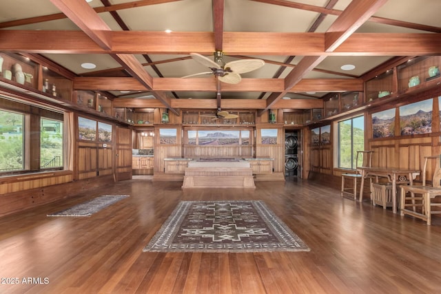 8752 E Range Rider Trl, Mesa, AZ 85207 - unfurnished living room featuring coffered ceiling, wood finished floors, ceiling fan, beamed ceiling, and wooden walls