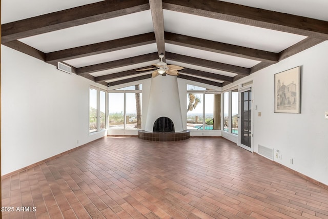 8752 E Range Rider Trl, Mesa, AZ 85207 - unfurnished living room with a ceiling fan, baseboards, and a large fireplace