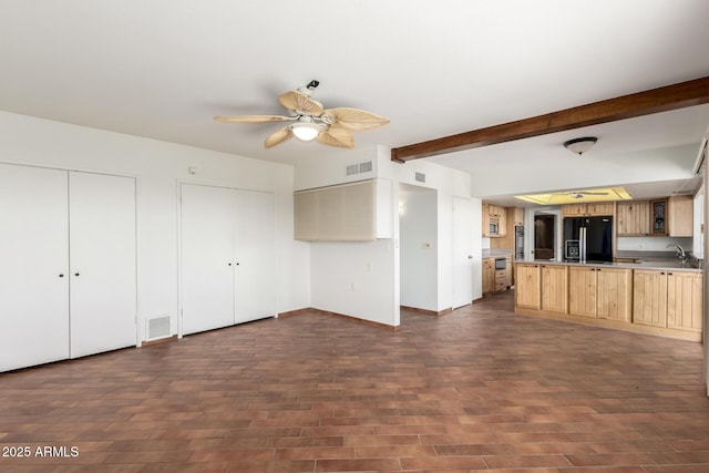 8752 E Range Rider Trl, Mesa, AZ 85207 - unfurnished living room featuring ceiling fan, dark wood-type flooring, beamed ceiling, baseboards, and a sink