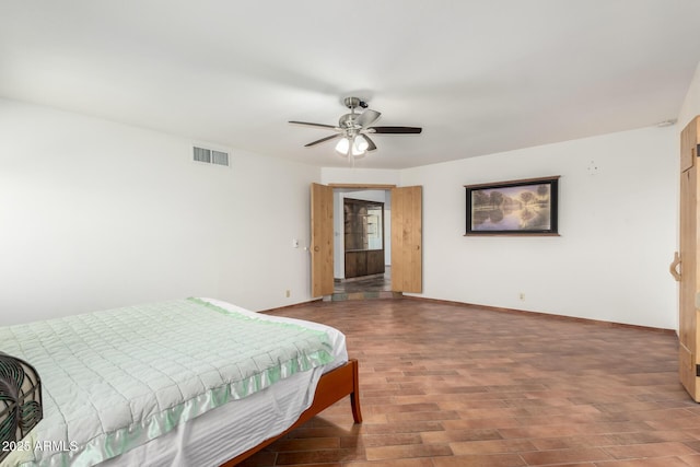 8752 E Range Rider Trl, Mesa, AZ 85207 - bedroom with wood finished floors, baseboards, and ceiling fan