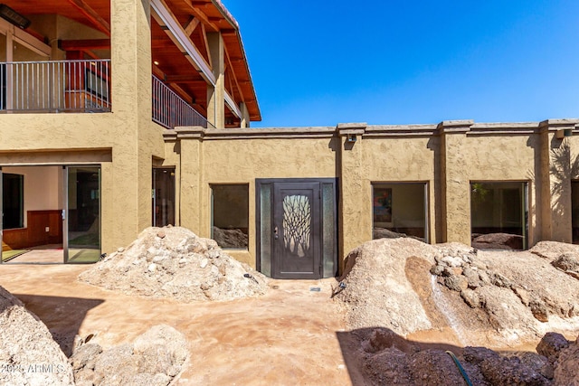 8752 E Range Rider Trl, Mesa, AZ 85207 - view of exterior entry with stucco siding