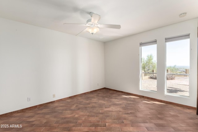 8752 E Range Rider Trl, Mesa, AZ 85207 - empty room with ceiling fan, wood finished floors, baseboards, and a smoke detector