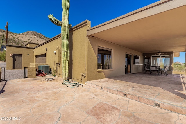 8752 E Range Rider Trl, Mesa, AZ 85207 - view of patio / terrace featuring ceiling fan, central AC, and a mountain view
