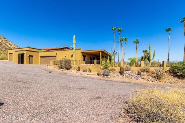 8752 E Range Rider Trl, Mesa, AZ 85207 - view of front of house featuring stucco siding and a garage