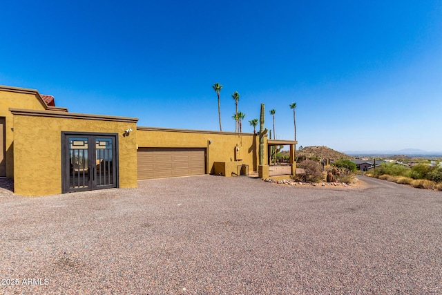 8752 E Range Rider Trl, Mesa, AZ 85207 - view of front facade featuring a garage, stucco siding, and driveway