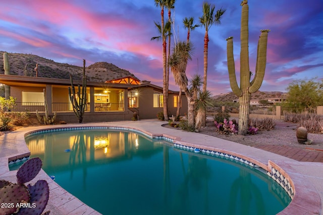 8752 E Range Rider Trl, Mesa, AZ 85207 - swimming pool featuring a mountain view and a patio