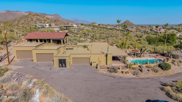 8752 E Range Rider Trl, Mesa, AZ 85207 - view of front of property featuring stucco siding, a mountain view, and driveway