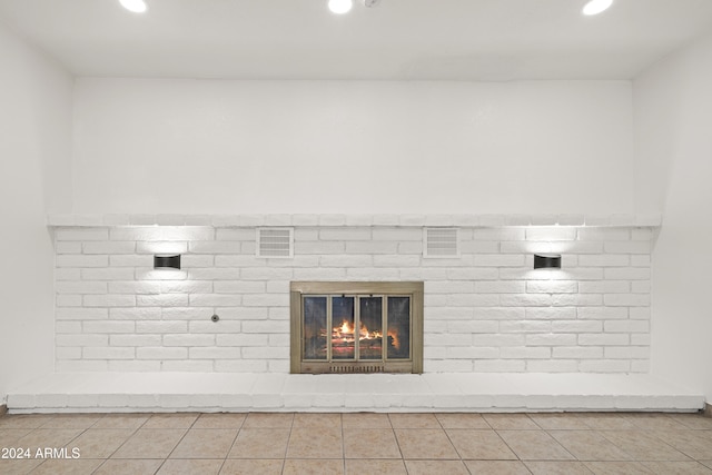 interior details with a fireplace and tile patterned flooring