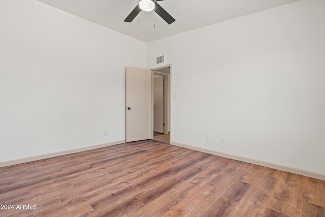 unfurnished room featuring hardwood / wood-style floors and ceiling fan