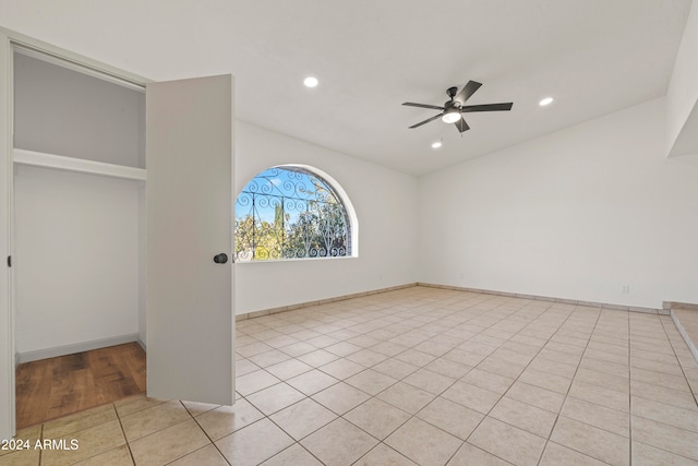 unfurnished room with ceiling fan and light tile patterned floors