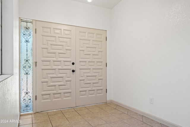 view of tiled foyer entrance