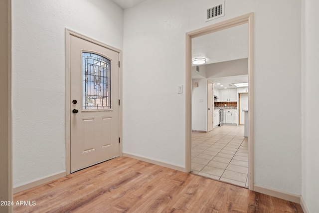 foyer entrance featuring light hardwood / wood-style floors