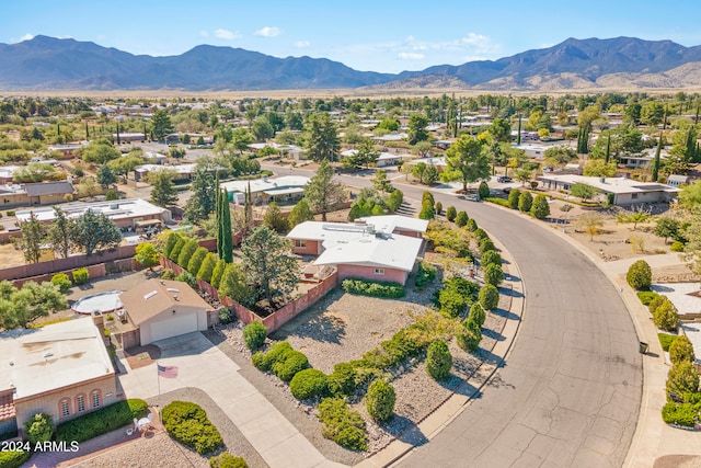 birds eye view of property with a mountain view