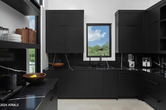 kitchen with modern cabinets and dark countertops