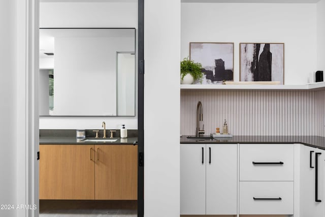 bar with a sink and indoor wet bar