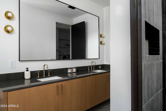 full bath featuring double vanity and a sink