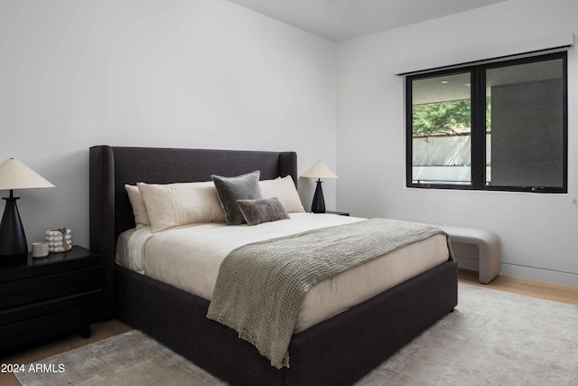 bedroom with wood finished floors