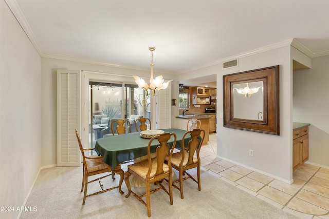 dining space featuring crown molding, sink, light tile patterned floors, and a notable chandelier