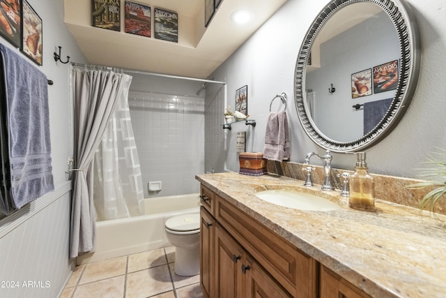 full bathroom featuring tile patterned floors, vanity, shower / bath combination with curtain, and toilet