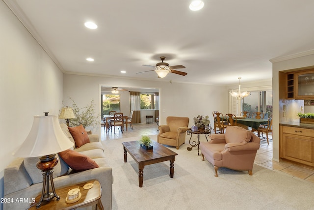 living room featuring crown molding, light tile patterned floors, and ceiling fan with notable chandelier