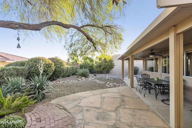 view of patio featuring ceiling fan