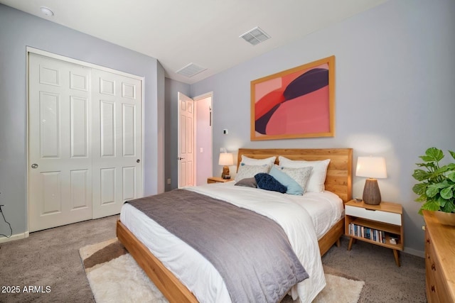 bedroom featuring baseboards, visible vents, a closet, and light colored carpet