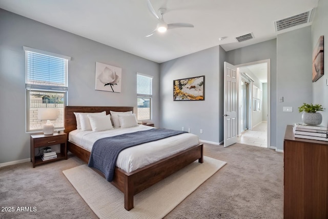 bedroom featuring baseboards, visible vents, ceiling fan, and light colored carpet