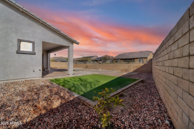 view of yard with a fenced backyard