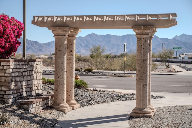 details featuring decorative columns and a mountain view