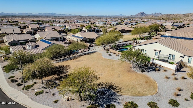 drone / aerial view featuring a residential view and a mountain view