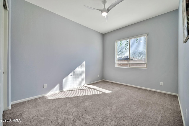 unfurnished room with ceiling fan, carpet floors, and baseboards